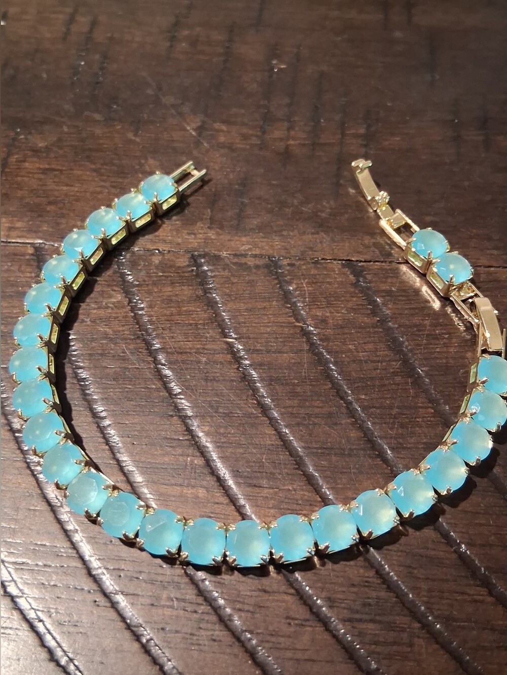 Gold Tennis Bracelet with Iced Light Aqua Blue Stones